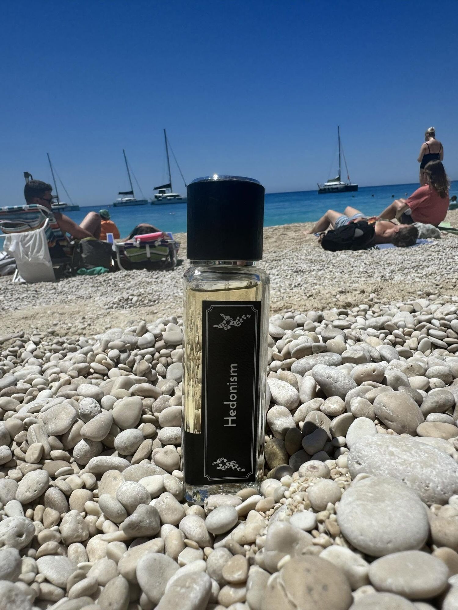 Hedonism on a pebble beach by the sea